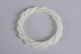 A WHITE JADE ARTICULATED BRACELET. 3ins diameter