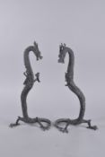 A PAIR OF CHINESE BRONZE DRAGONS. 16ins high.