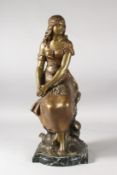 A. MOREAU. A GILDED METAL FIGURE OF A YOUNG LADY SITTING ON A ROCK. Signed. 18ins high on a marble