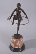 AFTER D. ALONZO. An Art Deco hoop girl, on a marble base. 19ins high. Signed.