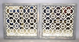 A PAIR OF GREY MOROCCAN GARDEN MIRRORS. 2ft square.