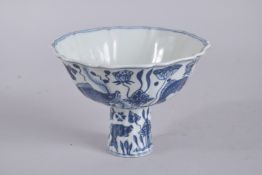 A CHINESE BLUE AND WHITE PETAL SHAPE PORCELAIN STEM CUP. 15.5cms wide.