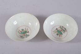 A PAIR OF CHINESE WUCAI PORCELAIN TEACUPS. 9cms diameter.