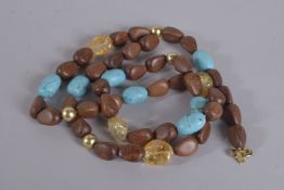 A KENNETH WOOD VINTAGE NECKLACE with turquoise stones.