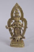 A GOOD BRASS MULTI ARM DEITY set with stones.