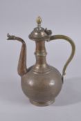 A LATE 19TH / EARLY 20TH CENTURY IRAN OR AFGHANISTAN COPPER AND BRASS LIDDED EWER, 36cm high.
