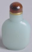 A 20TH CENTURY CHINESE JADE MINIATURE SNUFF BOTTLE, and agate stopper, 5.5cm.
