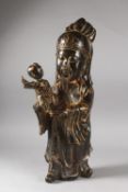 A FINE AND LARGE 19TH CENTURY CHINESE GILDED BRONZE FIGURE OF A DIGNITARY OR SAGE HOLDING A CHILD,