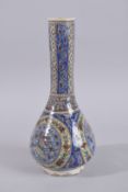 A TALL PERSIAN QAJAR GLAZED POTTERY VASE, painted with birds and floral designs, 36cm high.