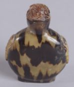 A 19TH CENTURY CHINESE TORTOISESHELL SNUFF BOTTLE, 6cm high.