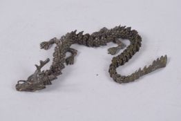 AN ARTICULATED BRONZE OKIMONO OF A DRAGON, 39cm long.