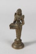 AN INDIAN BRONZE DEITY FIGURAL OIL LAMP, 15cm high.