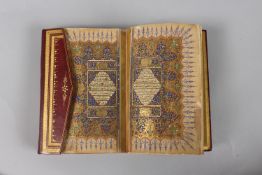 A VERY FINE SMALL OTTOMAN TURKISH LEATHER BOUND QURAN, with exceptional gilded and illuminated