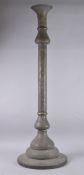 AN ISLAMIC SYRIAN OPENWORKED BRASS TORCH STAND / FLOOR LAMP, with panels of calligraphy, 153cm