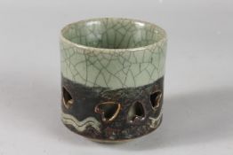 AN UNUSUAL JAPANESE CELADON CRACKLE GLAZE CENSER, 9.5cm high.