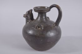 A CHINESE DOUBLE-SPOUTED CHICKEN SHAPED POT / EWER, Tang style, 20cm high.