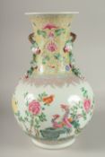 A LARGE CHINESE FAMILLE ROSE PORCELAIN VASE, painted with exotic birds and flora, with moulded