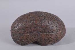 AN EARLY 20TH CENTURY KASHKOOL, with portraits and calligraphy, 25cm long.