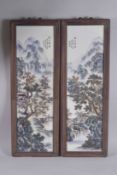 A PAIR OF CHINESE FRAMED PORCELAIN RECTANGULAR PANELS, with mountainous landscape scenes and