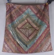 A 19TH-20TH CENTURY INDIAN MULTICOLOURED SILK FABRIC, 76cm x 74cm.