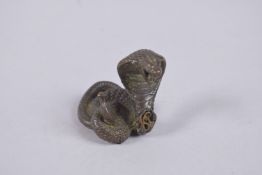 A BRONZE OKIMONO OF A SNAKE.