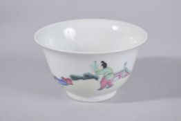 A CHINESE FAMILLE ROSE PORCELAIN TEA CUP, painted with figures and bat, base with six-character