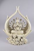A LARGE BLANC DE CHINE SEATED MULT-ARM GUANYIN, 54cm high.