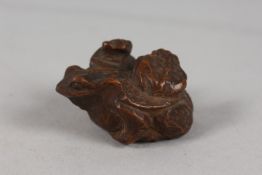 A JAPANESE CARVED WOOD 'THREE-TOAD' NETSUKE, 4.5cm.