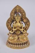 A FINE TIBETAN GILT ALLOY BUDDHA, inscribed to reverse, 17cm high.