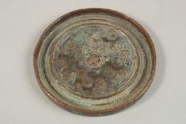 A CHINESE CIRCULAR BRONZE MIRROR, 8.5cm diameter.