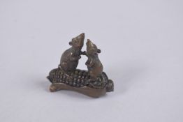 A BRONZE OKIMONO OF TWO RATS ON A CORN COB.