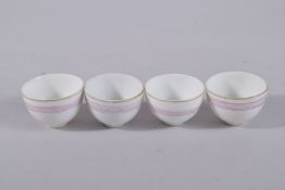 A SET OF FOUR SIGNED PORCELAIN CUPS MADE FOR THE ISLAMIC MARKET, 5.5cm diameter, (4).