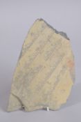 A RARE AND UNUSUAL POSSIBLE TIBETAN ENGRAVED SCHIST STONE FRAGMENT, with carved calligraphy, 23cm