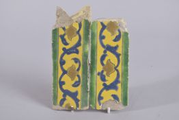 A PAIR OF 17TH CENTURY PERSIAN SAFAVID GLAZED BORDER TILES, largest 16cm long.