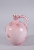 AN ISLAMIC MARKET PINK PORCELAIN VESSEL, with moulded decoration and gilt highlights, 20.5cm high.