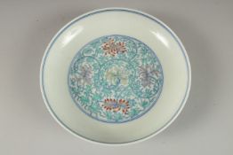 A CHINESE POLYCHROME PORCELAIN FLORAL DISH, the base with six- character mark, 16cm diameter.