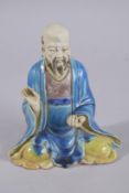 A CHINESE FAHUA STYLE GLAZED POTTERY FIGURE, 18cm high.