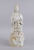 A LARGE 20TH CENTURY CHINESE QINGBAI POTTERY GUANYIN, 51cm high.