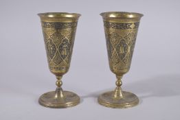 TWO QAJAR REVIVAL ENGRAVED BRASS CUPS, 18.5cm