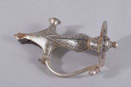 A 20TH CENTURY INDIAN SILVERED TULWAR HILT, 19cm long.