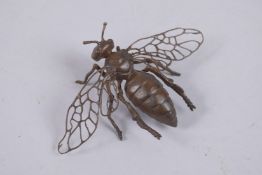A METAL FIGURE OF A BEE.