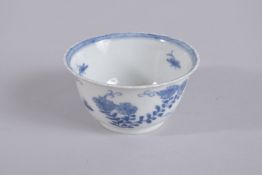 AN 18TH CENTURY CHINESE BLUE AND WHITE PORCELAIN TEA CUP, painted with flora, mark to base, 8.5cm