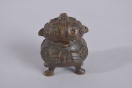 AN UNUSUAL BRONZE MINIATURE LIDDED CENSER, 5.5cm high.