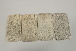 FOUR CHINESE WHITE METAL SCROLL WEIGHTS, each with stamped mark to reverse, (4).