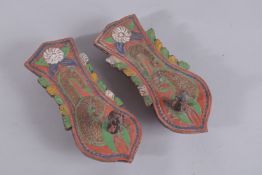 A PAIR OF 19TH CENTURY MALAY POLYCHROMED CARVED WOODEN SANDALS.