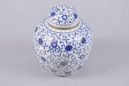 A EUROPEAN ISLAMIC MARKET PORCELAIN JAR AND COVER, 24cm high.