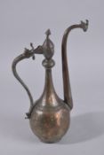 A 17TH-18TH CENTURY LATE SAFAVID TINNED COPPER EWER, 43cm high.