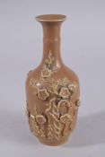 A CHINESE RELIEF DECORATED PORCELAIN VASE, with four-character mark to base, (faults), 22cm high.
