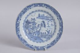 A 19TH CENTURY CHINESE BLUE AND WHITE PORCELAIN DISH, painted with a landscape scene, (faults), 23cm
