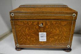 Marquetry inlaid rosewood sarcophagus shaped tea caddy.